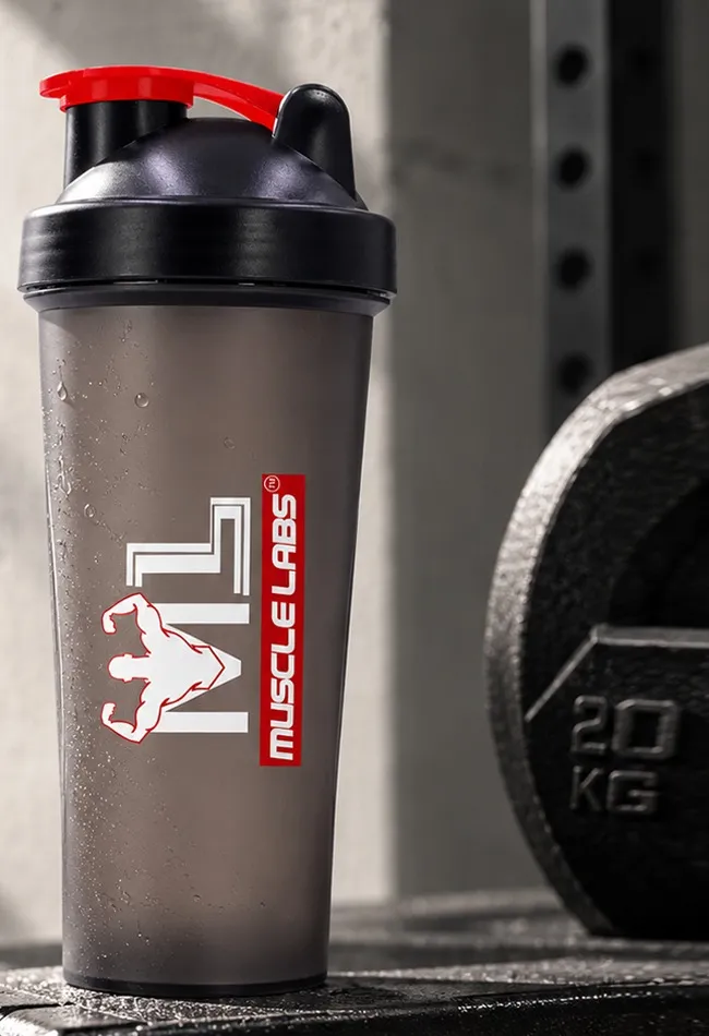 Muscle Labs shaker bottle on a gym box next to a 20 kg plate